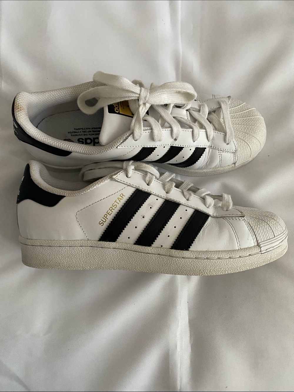 Adidas White and Black Superstar Sneakers with Gold Logo